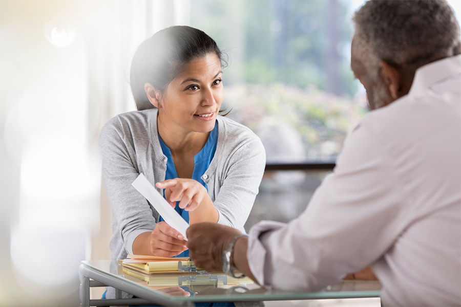 Woman showing a man some information