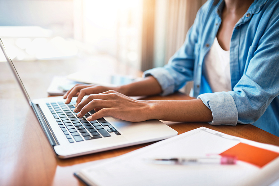 Person typing on a laptop