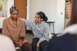 Woman consoling another woman